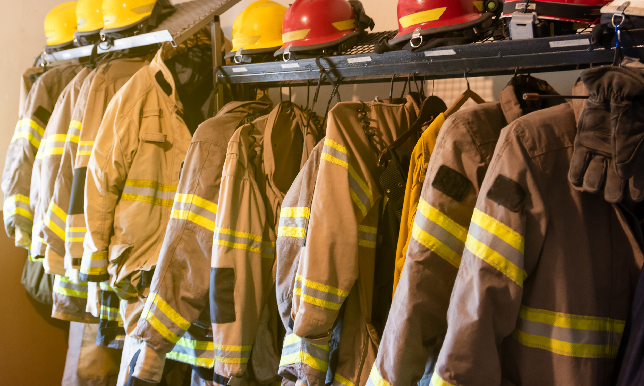 Firefighter gear hanging in a locker room after a Owasso car crash